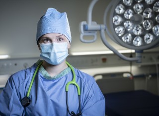 Medical School student in surgical gown