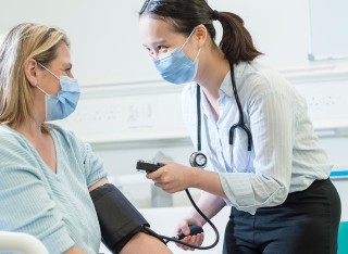 Student taking blood pressure