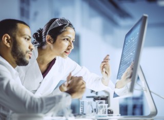 scientists-look-at-computer-GETTY