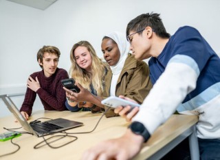 University of Surrey students looking at devices
