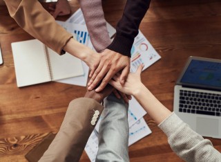 a partnership of 6 hands and arms 