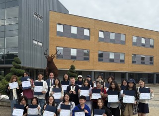 SII-DUFE Summer School 2025 group picture of participants holding certificates