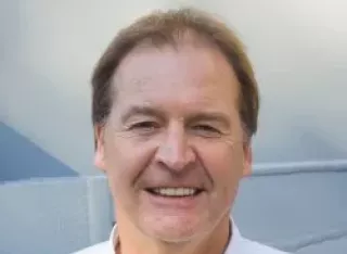 Visiting Professor Chris Cowls MBA of the University of Surrey