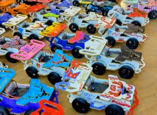 Toy electric vehicles lined up
