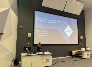 Photo of Emily giving a speech at The British Psychological Society.