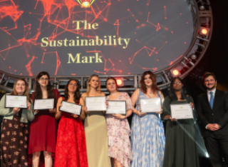 Seven students receiving a sustainability mark award