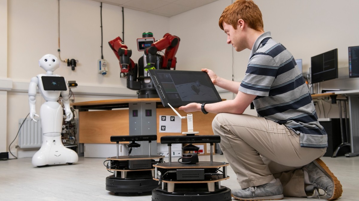Electrical and electronic engineering student in robotics lab