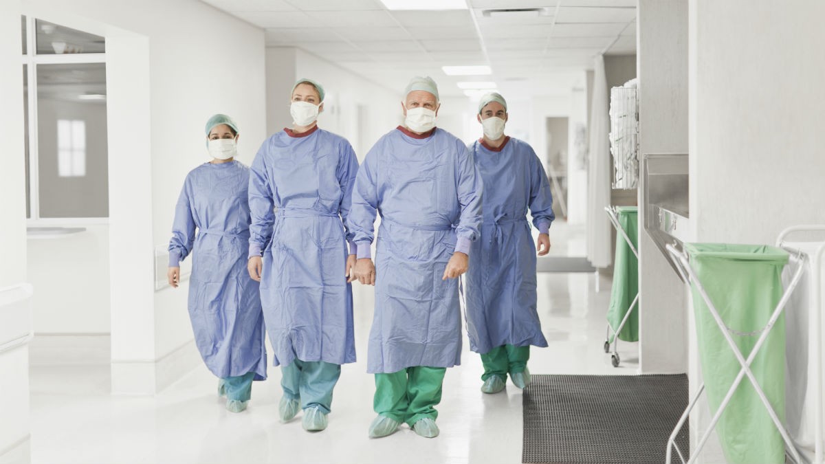 Surgeons walking down a hospital corridor
