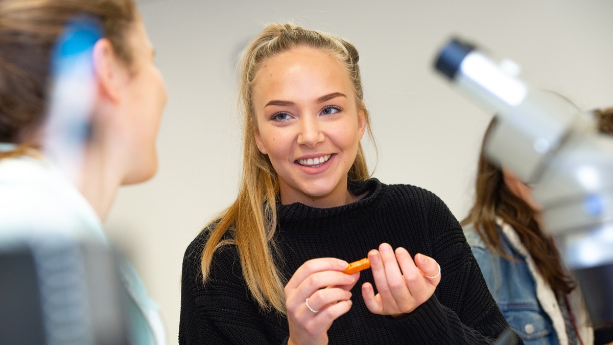Student pricking her finger to test her blood sugar levels
