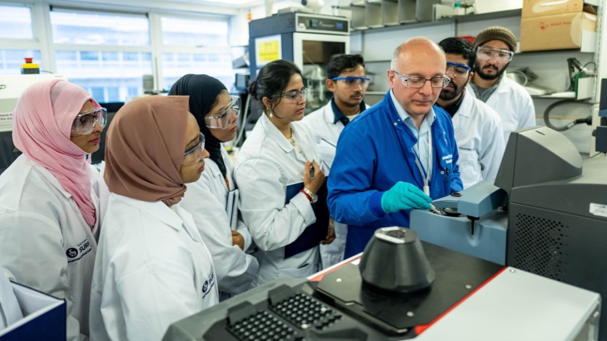 A tutor demonstrates to Pharmaceutical Sciences students