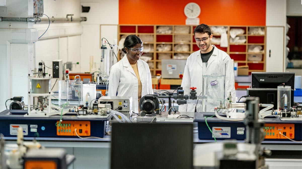 Two Surrey students getting down to work in our Chemical Engineering lab