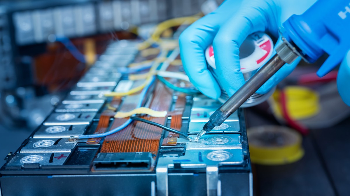 Technician soldering lithium-ion battery 