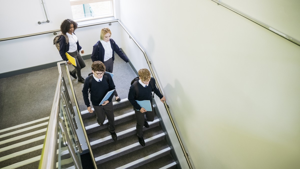 uk school children walk downstairs