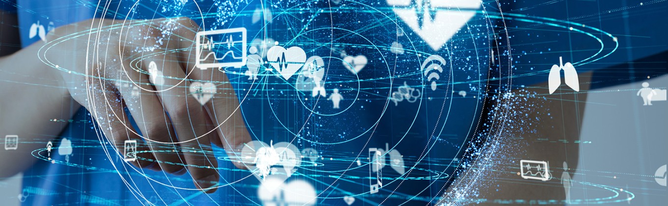 A person is using a tablet, there are graphics emerging from the screen which demonstrate a medical technology concept